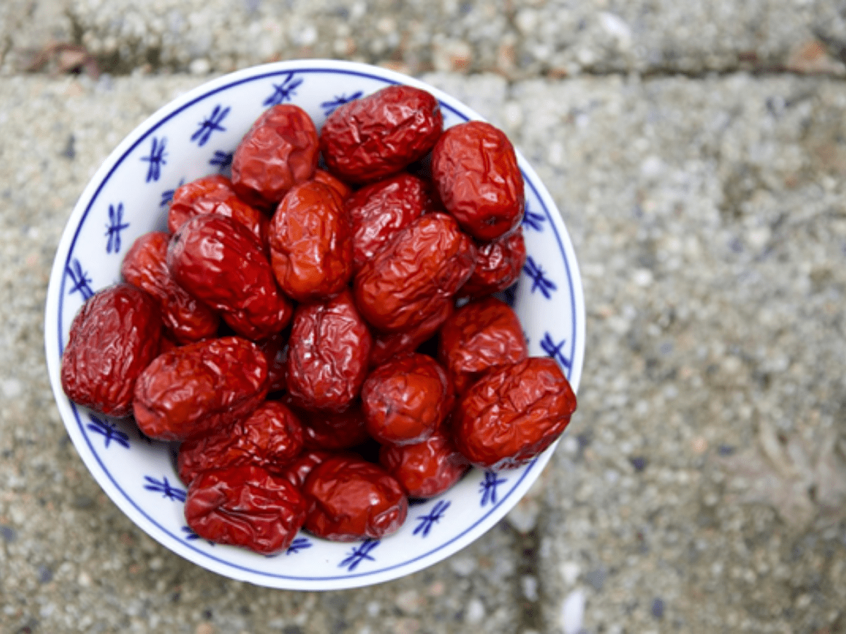 Bowl of Jujubes in a white and blue porcelain bowl