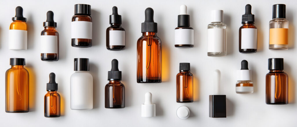 Dropper bottles stand arranged showcasing various forms of skinc
